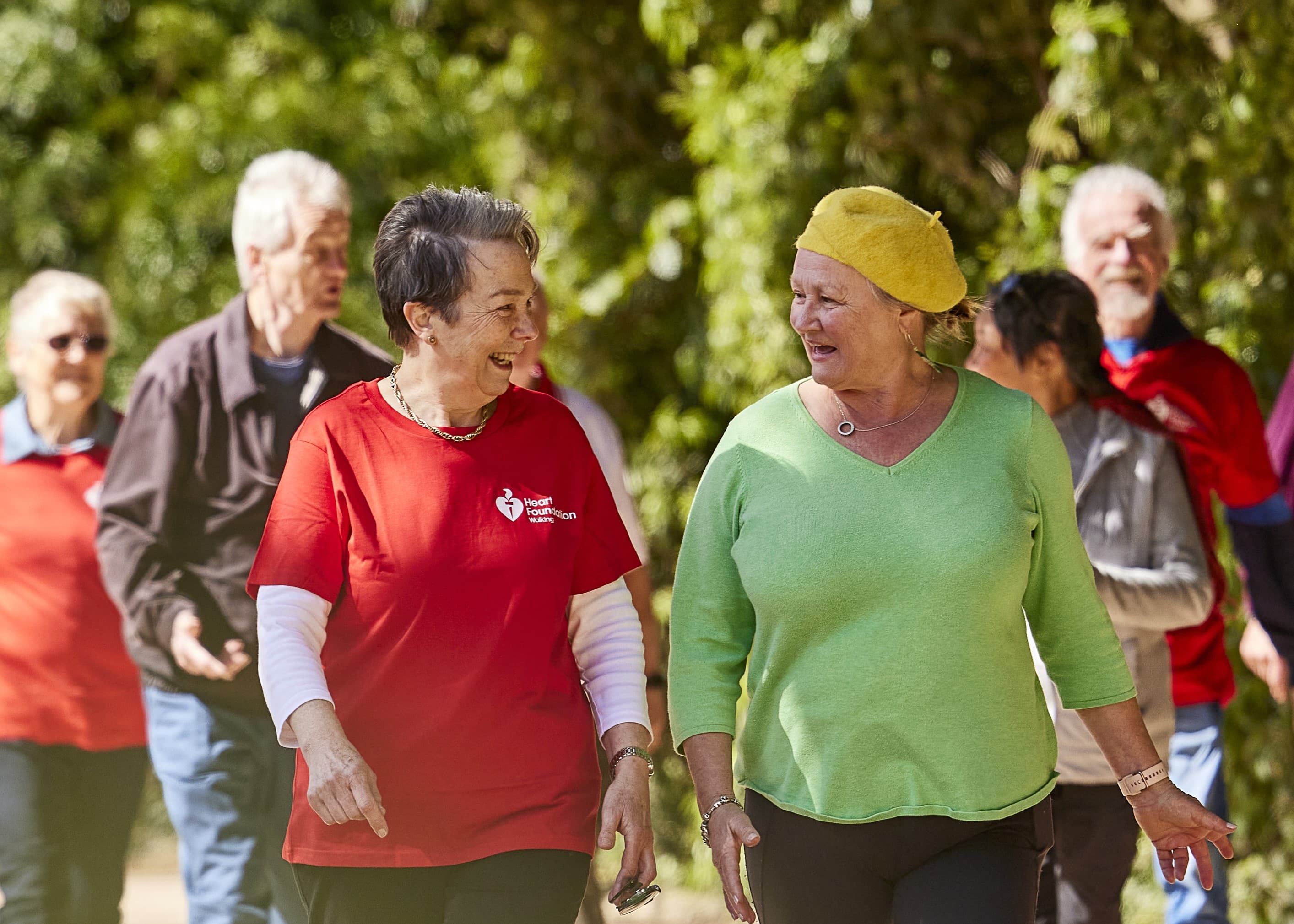 Two female group walkers walking and talking