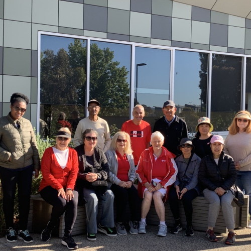 Group of community walkers sitting for a photo